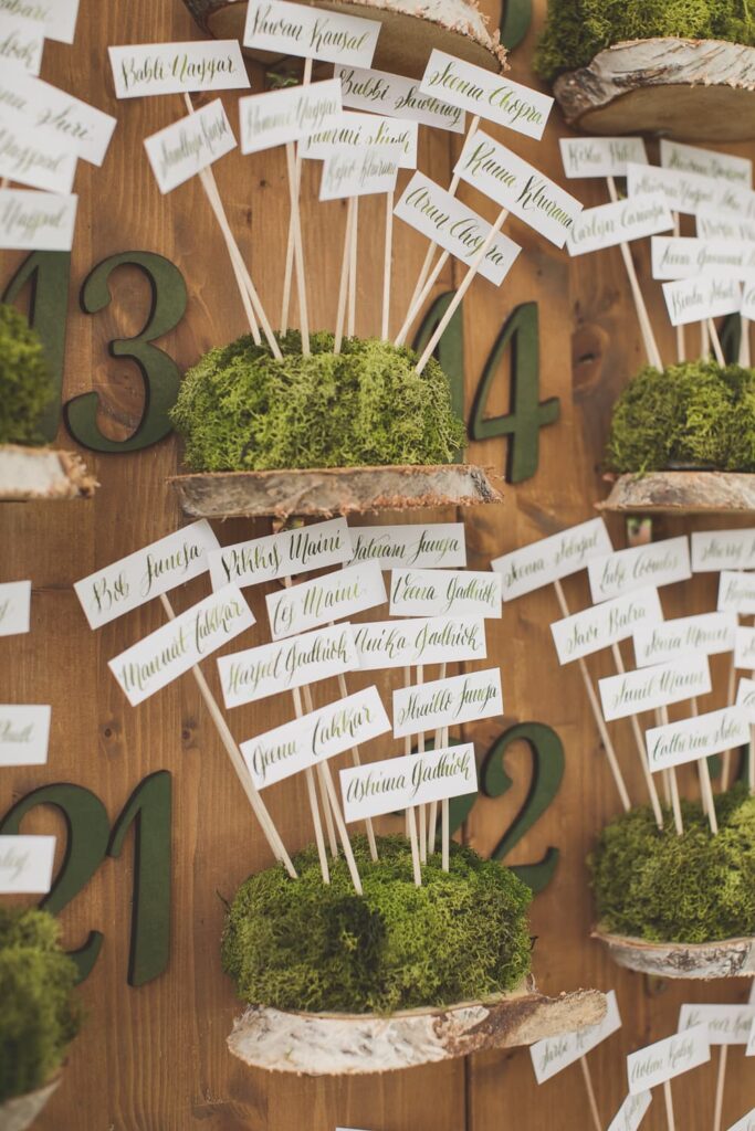 Woodland themed place cards on moss base