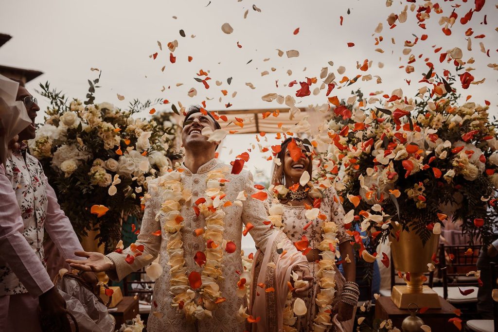 Bride and groom exit with petals at Renaissance Il Ciocco Resort and Spa Wedding